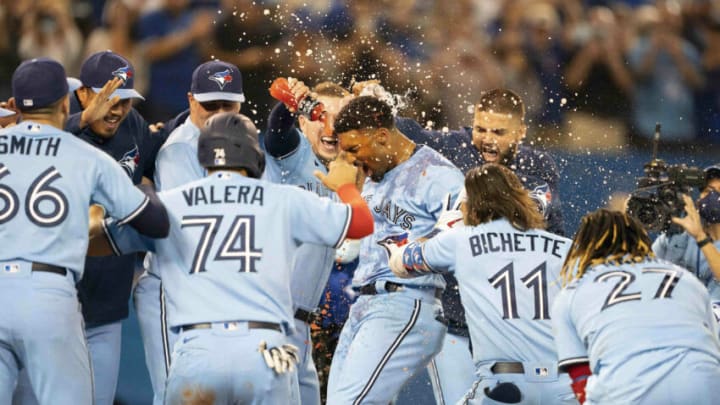 Sep 3, 2021; Toronto, Ontario, CAN; Toronto Blue Jays shortstop Marcus Semien (10) celebrates with the team after hitting a walkoff home run during the ninth inning against the Oakland Athletics at Rogers Centre. Mandatory Credit: Nick Turchiaro-USA TODAY Sports Sep 3, 2021; Toronto, Ontario, CAN; Toronto Blue Jays shortstop Marcus Semien (10) celebrates with the team after hitting a walkoff home run during the ninth inning against the Oakland Athletics at Rogers Centre. Mandatory Credit: Nick Turchiaro-USA TODAY Sports