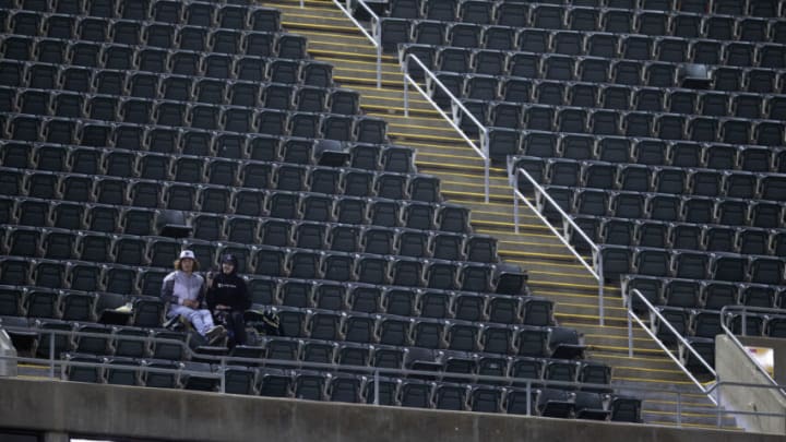 May 2, 2022; Oakland, California, USA; Two Oakland Athletics fans have the upper deck to themselves during the eighth inning of a game between the A’s and the Tampa Bay Rays at RingCentral Coliseum. The announced attendance for the game was 2,488. Mandatory Credit: D. Ross Cameron-USA TODAY Sports