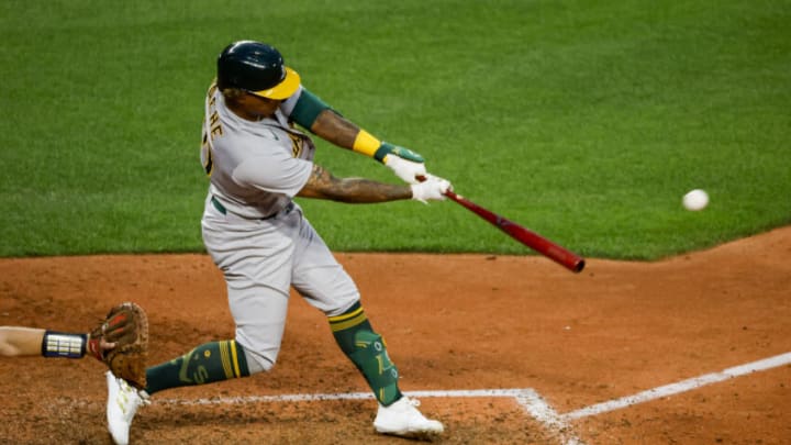 May 23, 2022; Seattle, Washington, USA; Oakland Athletics center fielder Cristian Pache (20) hits a two-run double against the Seattle Mariners during the sixth inning at T-Mobile Park. Mandatory Credit: Joe Nicholson-USA TODAY Sports May 23, 2022; Seattle, Washington, USA; Oakland Athletics center fielder Cristian Pache (20) hits a two-run double against the Seattle Mariners during the sixth inning at T-Mobile Park. Mandatory Credit: Joe Nicholson-USA TODAY Sports
