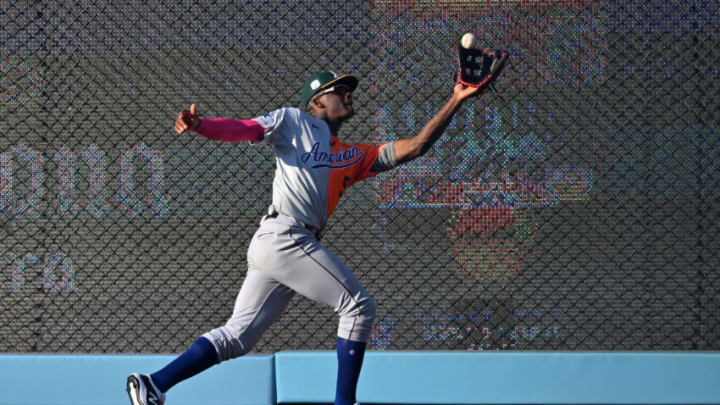 Jul 16, 2022; Los Angeles, CA, USA; American League Futures right fielder Denzel Clarke (5) makes a catch at the wall on a ball hit by National League Futures catcher Diego Cartaya (not pictured) in the seventh inning of the All Star-Futures Game at Dodger Stadium. Mandatory Credit: Jayne Kamin-Oncea-USA TODAY Sports