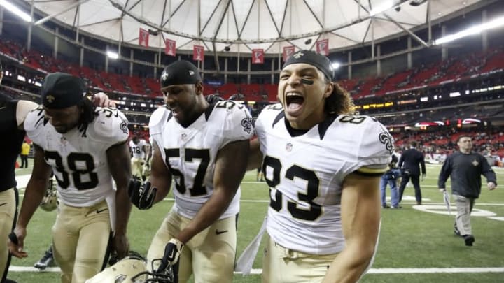 Jan 3, 2016; Atlanta, GA, USA; New Orleans Saints running back Travaris Cadet (38) and outside linebacker David Hawthorne (57) and wide receiver Willie Snead (83) celebrate as they walk off of the field following their win against the Atlanta Falcons at the Georgia Dome. The Saints won 20-17. Mandatory Credit: Jason Getz-USA TODAY Sports