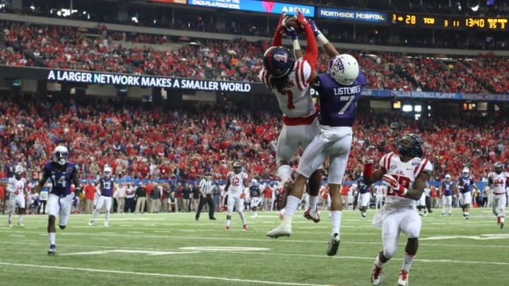 Dec 31, 2014; Atlanta , GA, USA; TCU Horned Frogs wide receiver Kolby Listenbee (7) catches a touchdown pass as he is defended by Mississippi Rebels defensive back Trae Elston (7) and LaKedrick King (28) during the third quarter in the 2014 Peach Bowl at the Georgia Dome. Mandatory Credit: Jason Getz-USA TODAY Sports