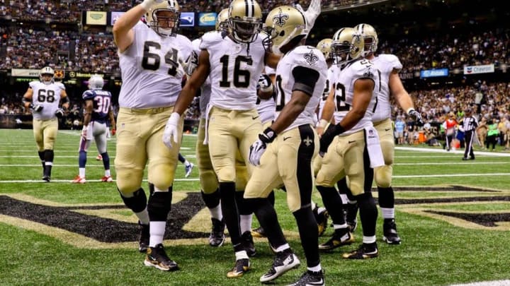 Aug 22, 2015; New Orleans, LA, USA; New Orleans Saints wide receiver Brandin Cooks (10) celebrates with teammates wide receiver Brandon Coleman (16) and tackle Zach Strief (64)following a touchdown against the New England Patriots during the second quarter of a preseason game at the Mercedes-Benz Superdome. Mandatory Credit: Derick E. Hingle-USA TODAY Sports