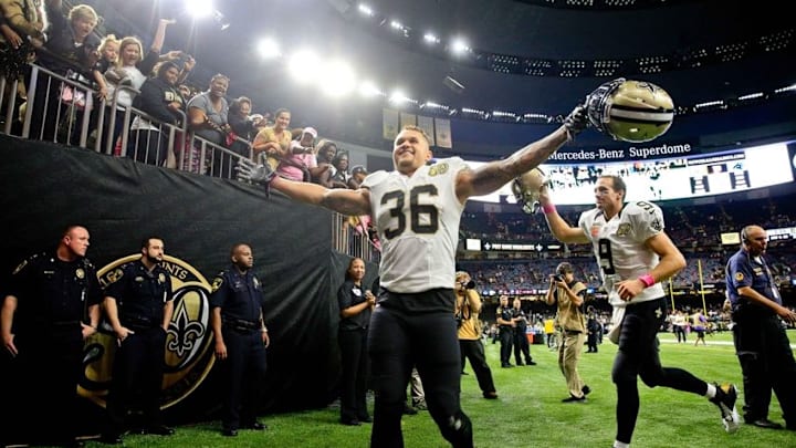 Oct 16, 2016; New Orleans, LA, USA; New Orleans Saints running back Daniel Lasco (36) and quarterback Drew Brees (9) celebrate following a win against the Carolina Panthers in a game at the Mercedes-Benz Superdome. The Saints defeated the Panthers 41-38. Mandatory Credit: Derick E. Hingle-USA TODAY Sports Oct 16, 2016; New Orleans, LA, USA; New Orleans Saints running back Daniel Lasco (36) and quarterback Drew Brees (9) celebrate following a win against the Carolina Panthers in a game at the Mercedes-Benz Superdome. The Saints defeated the Panthers 41-38. Mandatory Credit: Derick E. Hingle-USA TODAY Sports