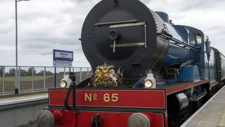 BELLARENA, NORTHERN IRELAND, JUNE 28: Queen Elizabeth II and Prince Philip, Duke Of Edinburgh arrive on a steam train to open the new Bellarena Station village on June 28, 2016 in Bellarena, Northern Ireland. (Photo by Carrie Davenport/Getty Images)