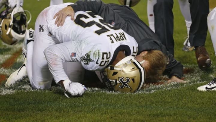 CHICAGO, ILLINOIS - OCTOBER 20: Eli Apple #25 of the New Orleans Saints puts his head down after he was injured on a play during the second half against the Chicago Bears at Soldier Field on October 20, 2019 in Chicago, Illinois. (Photo by Nuccio DiNuzzo/Getty Images)