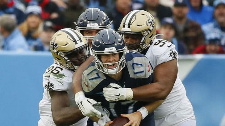 NASHVILLE, TENNESSEE - DECEMBER 22: Quarterback Ryan Tannehill #17 of the Tennessee Titans is sacked by the New Orleans Saints defense during the third quarter in the game at Nissan Stadium on December 22, 2019 in Nashville, Tennessee. (Photo by Frederick Breedon/Getty Images)