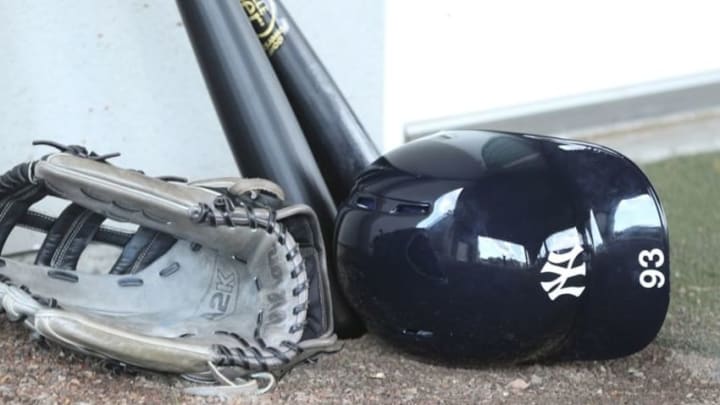 Mar 2, 2015; Tampa, FL, USA; New York Yankees center fielder Jake Cave (93) hat glove and ball rests near the clubhouse during spring training workouts at George M. Steinbrenner Field. Mandatory Credit: Reinhold Matay-USA TODAY Sports