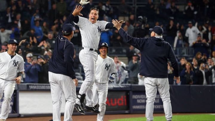 Sep 28, 2016; Bronx, NY, USA; New York Yankees first baseman Mark Teixeira (25) celebrates with teammates after hitting a walk off grand slam against the Boston Red Sox during the ninth inning at Yankee Stadium. Mandatory Credit: Brad Penner-USA TODAY Sports