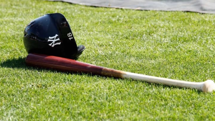 Mar 26, 2015; Port Charlotte, FL, USA; New York Yankees shortstop Didi Gregorius (not pictured) helmet and bat lays on the field prior to the game against the Tampa Bay Rays at Charlotte Sports Park. Mandatory Credit: Kim Klement-USA TODAY Sports