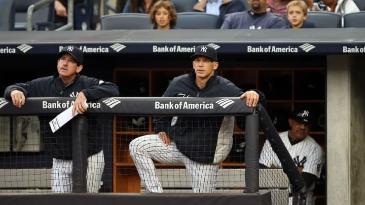Oct 2, 2016; Bronx, NY, USA; New York Yankees manager Joe Girardi watches from the dugout during the season finale against the Baltimore Orioles at Yankee Stadium. Mandatory Credit: Danny Wild-USA TODAY Sports