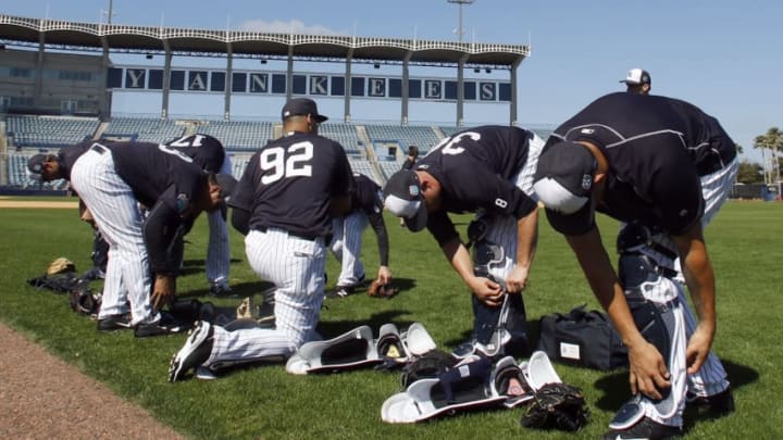 Feb 20, 2016; Tampa, FL, USA; New York Yankees catchers put on their gear during practice at George M. Steinbrenner Stadium. Mandatory Credit: Butch Dill-USA TODAY Sports