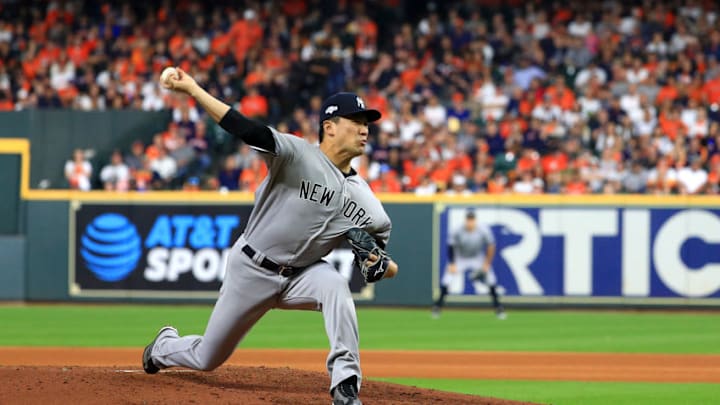 HOUSTON, TEXAS - OCTOBER 12: Masahiro Tanaka #19 of the New York Yankees delivers the pitch against the Houston Astros during the fourth inning in game one of the American League Championship Series at Minute Maid Park on October 12, 2019 in Houston, Texas. (Photo by Mike Ehrmann/Getty Images) HOUSTON, TEXAS - OCTOBER 12: Masahiro Tanaka #19 of the New York Yankees delivers the pitch against the Houston Astros during the fourth inning in game one of the American League Championship Series at Minute Maid Park on October 12, 2019 in Houston, Texas. (Photo by Mike Ehrmann/Getty Images)