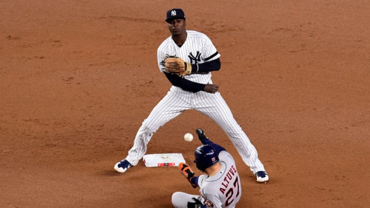 NEW YORK, NEW YORK - OCTOBER 18: Didi Gregorius #18 of the New York Yankees tags out Jose Altuve #27 of the Houston Astros during the seventh inning in game five of the American League Championship Series at Yankee Stadium on October 18, 2019 in New York City. (Photo by Emilee Chinn/Getty Images)