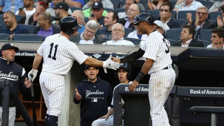 NEW YORK, NY - JUNE 12: Aaron Hicks #31 of the New York Yankees celebrates scoring a run with Brett Gardner #11 in the second inning against the Washington Nationals during their game at Yankee Stadium on June 12, 2018 in New York City. (Photo by Al Bello/Getty Images)