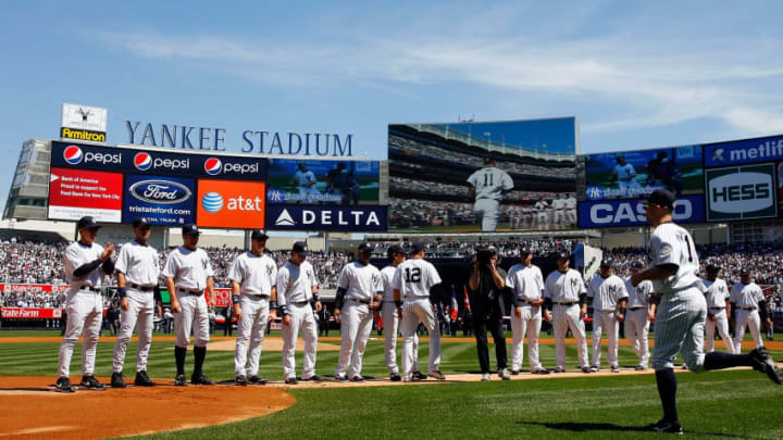 NEW YORK - APRIL 16: The New York Yankees line up during player introductions prior to theri opening day game against the Cleveland Indians on April 16, 2009 at Yankee Stadium in the Bronx borough of New York City. This is the first MLB regular season game being played at the new venue,which replaced the old Yankee Stadium as the Yankees home field. (Photo by Jim McIsaac/Getty Images)