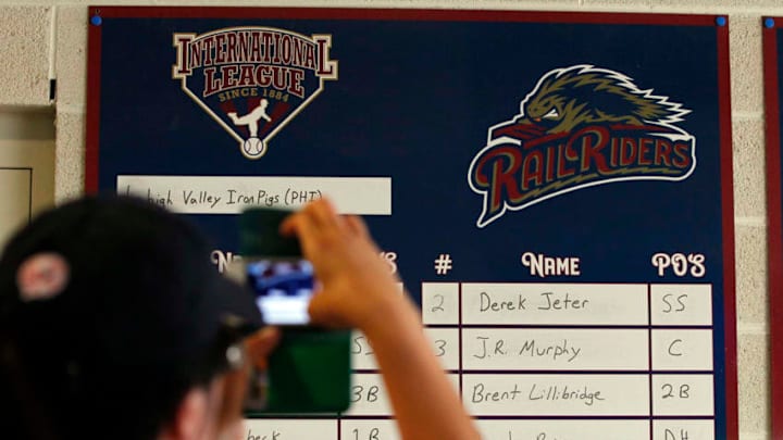 MOOSIC, PA - JULY 6: A fan takes a photo of Derek Jeter's name on the line-up board during a rehab assignment for the Scranton/Wilkes-Barre RailRiders before a game against the Lehigh Valley IronPigs at PNC Field on July 6, 2013 in Moosic, Pennsylvania. (Photo by Hunter Martin/Getty Images) MOOSIC, PA - JULY 6: A fan takes a photo of Derek Jeter's name on the line-up board during a rehab assignment for the Scranton/Wilkes-Barre RailRiders before a game against the Lehigh Valley IronPigs at PNC Field on July 6, 2013 in Moosic, Pennsylvania. (Photo by Hunter Martin/Getty Images)