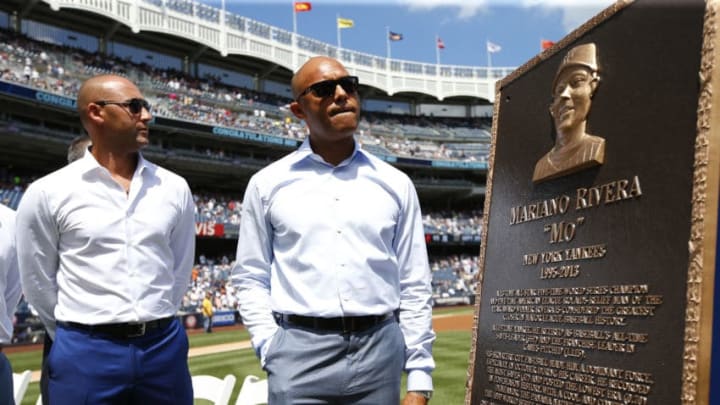 NEW YORK, NY - AUGUST 14: Derek Jeter (L) and Mariano Rivera look at Rivera's plaque during a ceremony before a game between the Tampa Bay Rays and the New York Yankees at Yankee Stadium on August 14, in the Bronx borough of New York City. (Photo by Rich Schultz/Getty Images)