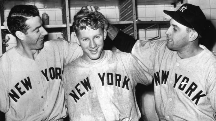 Whitey Ford, center is congratulated by Joe DiMaggio, left, and Gene Woodling (Photo by Mark Rucker/Transcendental Graphics, Getty Images)