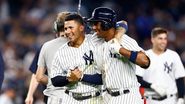 Miguel Andujar #41 and Gleyber Torres #25 of the New York Yankees celebrate after defeating the Baltimore Orioles in the eleventh inning on Aaron Hicks #31 walk-off RBI double at Yankee Stadium on September 22, 2018 in the Bronx borough of New York City. New York Yankees defeated the Baltimore Orioles 3-2 in eleventh inning. (Photo by Mike Stobe/Getty Images) Miguel Andujar #41 and Gleyber Torres #25 of the New York Yankees celebrate after defeating the Baltimore Orioles in the eleventh inning on Aaron Hicks #31 walk-off RBI double at Yankee Stadium on September 22, 2018 in the Bronx borough of New York City. New York Yankees defeated the Baltimore Orioles 3-2 in eleventh inning. (Photo by Mike Stobe/Getty Images)