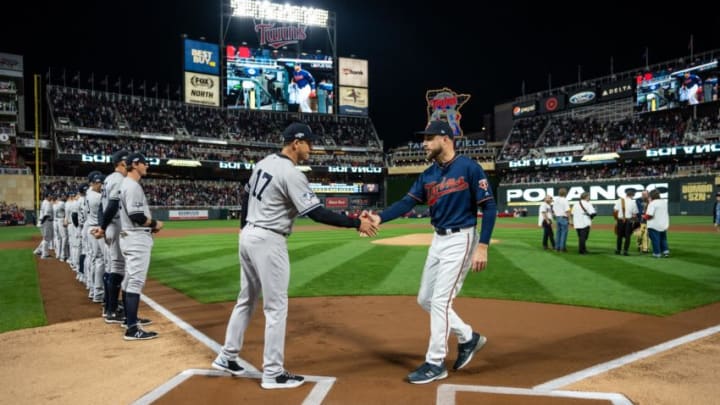 MINNEAPOLIS, MN - OCTOBER 07: Managers Rocco Baldelli #5 of the Minnesota Twins and Aaron Boone #17 of the New York Yankees meet prior to the game on October 7, 2019 in game three of the American League Division Series at the Target Field in Minneapolis, Minnesota. (Photo by Brace Hemmelgarn/Minnesota Twins/Getty Images)