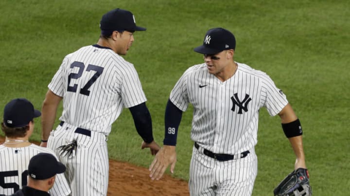 NEW YORK, NEW YORK - AUGUST 02: (NEW YORK DAILIES OUT) Aaron Judge #99 and Giancarlo Stanton #27 of the New York Yankees celebrate after defeating the Boston Red Sox at Yankee Stadium on August 02, 2020 in New York City. The Yankees defeated the Red Sox 9-7. (Photo by Jim McIsaac/Getty Images)