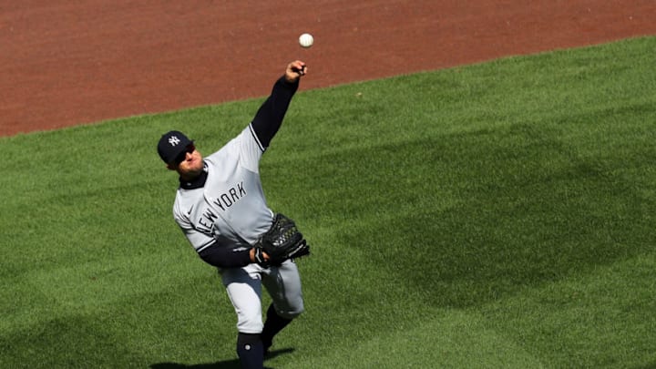 Brett Gardner #11 of the New York Yankees makes a throw during the third inning against the Boston Red Sox at Fenway Park on September 20, 2020 in Boston, Massachusetts. (Photo by Maddie Meyer/Getty Images)