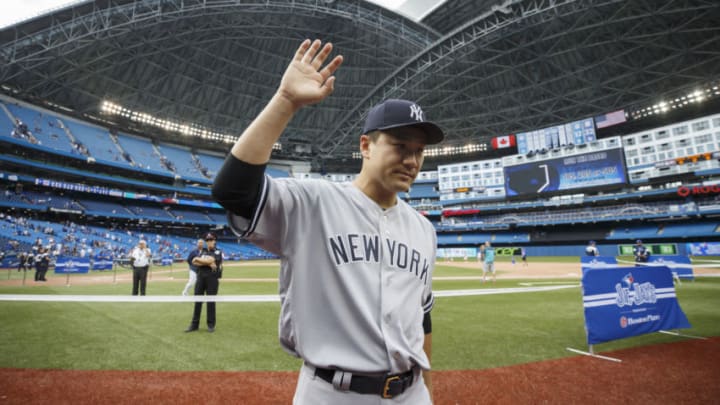 TORONTO, ON - AUGUST 11: Masahiro Tanaka #19 of the New York Yankees waves to fans as he leaves the field following a 1-0 victory in MLB action against the Toronto Blue Jays at Rogers Centre on August 11, 2019 in Toronto, Canada. (Photo by Cole Burston/Getty Images)