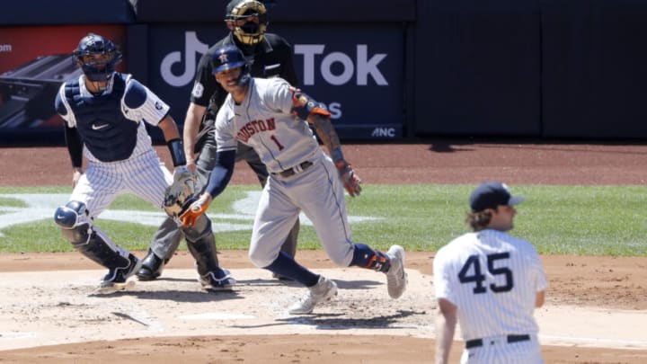NEW YORK, NEW YORK - MAY 06: Carlos Correa #1 of the Houston Astros in action against Kyle Higashioka #66 and Gerrit Cole #45 of the New York Yankees. (Photo by Jim McIsaac/Getty Images)