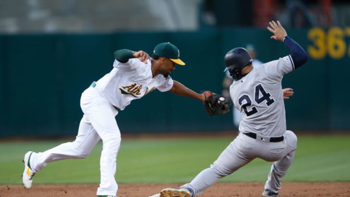 OAKLAND, CA - AUGUST 22: Marcus Semien #10 of the Oakland Athletics tags Gary Sanchez #24 of the New York Yankees out at second during the game at the Oakland-Alameda County Coliseum on August 22, 2019 in Oakland, California. The Athletics defeated the Yankees 5-3. (Photo by Michael Zagaris/Oakland Athletics/Getty Images)