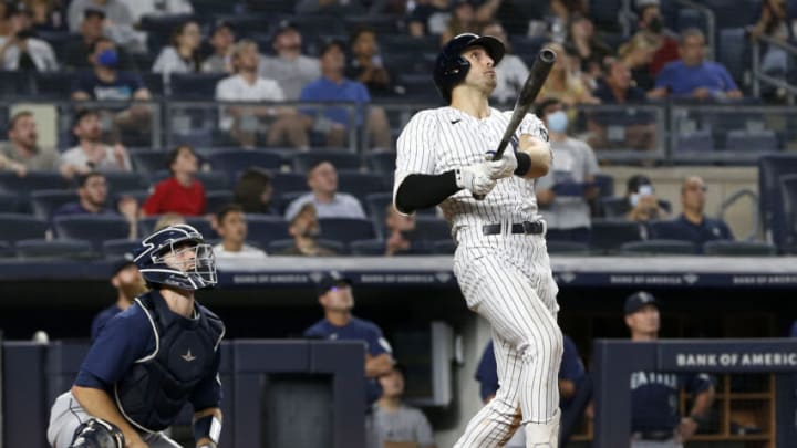 NEW YORK, NEW YORK - AUGUST 05: Joey Gallo #13 of the New York Yankees follows through on his seventh inning three run home run against the Seattle Mariners at Yankee Stadium on August 05, 2021 in New York City. The Yankees defeated the Mariners 5-3. (Photo by Jim McIsaac/Getty Images)