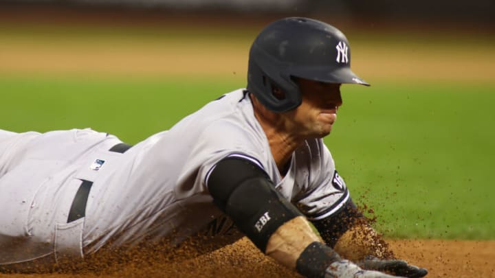 NEW YORK, NEW YORK - SEPTEMBER 10: Brett Gardner #11 of the New York Yankees slides into third base after hitting a first inning triple against the against the New York Mets at Citi Field on September 10, 2021 in New York City. (Photo by Mike Stobe/Getty Images)