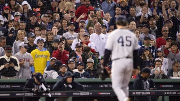 BOSTON, MA - OCTOBER 05: Fans react as Gerrit Cole #45 of the Boston Red Sox exits the game during the third inning of the 2021 American League Wild Card game against the Boston Red Sox at Fenway Park on October 5, 2021 in Boston, Massachusetts. (Photo by Billie Weiss/Boston Red Sox/Getty Images)