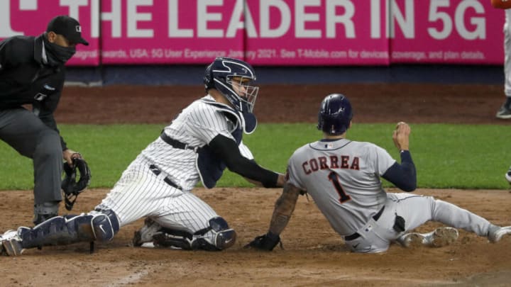 NEW YORK, NEW YORK - MAY 05: (NEW YORK DAILIES OUT) Gary Sanchez #24 of the New York Yankees tags out Carlos Correa #1 of the Houston Astros during the fourth inning at Yankee Stadium on May 05, 2021 in New York City. The Yankees defeated the Astros 6-3. (Photo by Jim McIsaac/Getty Images)