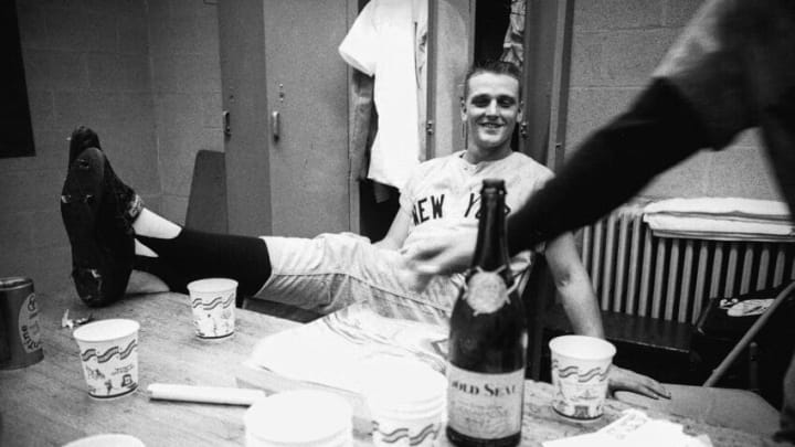 BRONX, NY - 1961: Roger Maris #9 of the New York Yankees celebrates in the clubhouse with the media after a MLB game in the Bronx, New York in 1961. (Photo by C&G Collections/Getty Images)