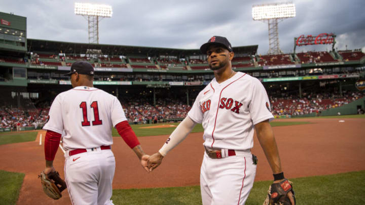 BOSTON, MA - AUGUST 9: Rafael Devers #11 reacts with Xander Bogaerts #22 of the Boston Red Sox before a game against the Atlanta Braves on August 9, 2022 at Fenway Park in Boston, Massachusetts. (Photo by Billie Weiss/Boston Red Sox/Getty Images)