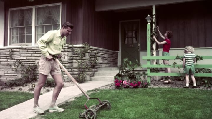 In this photo from the Smithsonian Institution's exhibit, a man mows his lawn in Long Beach, California, in the 1950s.