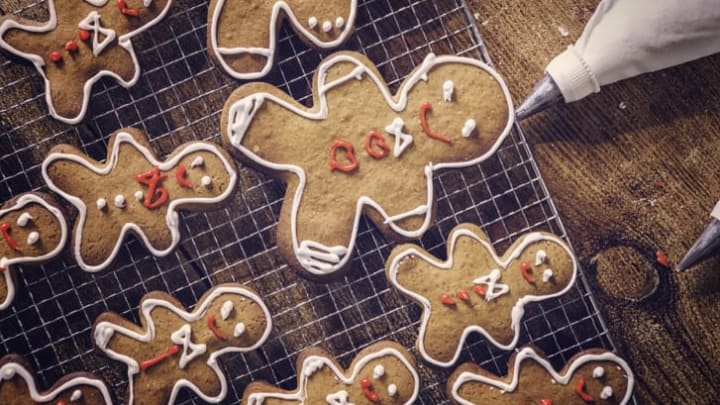 A photo of gingerbread cookies being iced