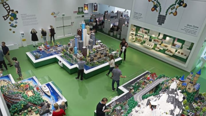 Kids play with LEGOs in the World Explorer section, which has three themed islands filled with LEGO mini-figures. The LEGO Group