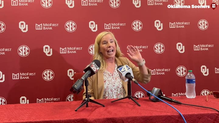 Oklahoma coach Patty Gasso speaks after her statue was unveiled at Love's Field.