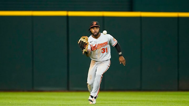Baltimore Orioles center fielder Cedric Mullins reaches out to field a ball during a baseball game against the Texas Rangers, Tuesday, Aug. 2, 2022, in Arlington, Texas. (AP Photo/Tony Gutierrez) Baltimore Orioles center fielder Cedric Mullins reaches out to field a ball during a baseball game against the Texas Rangers, Tuesday, Aug. 2, 2022, in Arlington, Texas. (AP Photo/Tony Gutierrez)