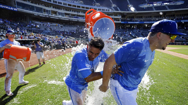 Kansas City Royals' Nicky Lopez, center, and Vinnie Pasquantino, right, are double doused by Bobby Witt Jr., left, and MJ Melendez, back, as they celebrate their team's win over the Chicago White Sox in a baseball game in Kansas City, Mo., Thursday, Aug. 11, 2022. (AP Photo/Colin E. Braley) Kansas City Royals' Nicky Lopez, center, and Vinnie Pasquantino, right, are double doused by Bobby Witt Jr., left, and MJ Melendez, back, as they celebrate their team's win over the Chicago White Sox in a baseball game in Kansas City, Mo., Thursday, Aug. 11, 2022. (AP Photo/Colin E. Braley)