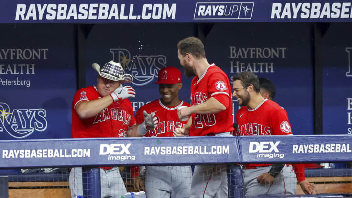 Los Angeles Angels' Mike Trout, left, is congratulated by teammates after his home run against the Tampa Bay Rays during the eighth inning of a baseball game Wednesday, Aug. 24, 2022, in St. Petersburg, Fla. (AP Photo/Mike Carlson)