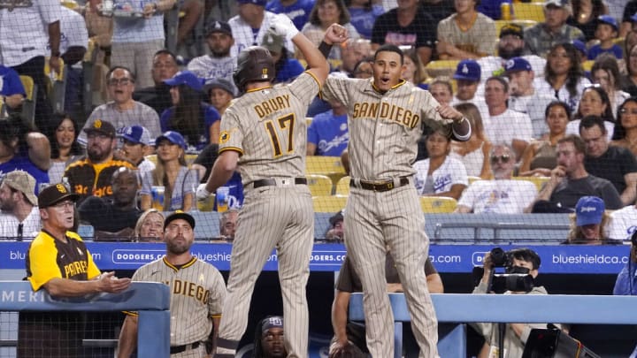 San Diego Padres' Brandon Drury, left, and Manny Machado celebrate after Drury hit a two-run home run during the third inning of a baseball game against the Los Angeles Dodgers Friday, Sept. 2, 2022, in Los Angeles. (AP Photo/Mark J. Terrill) San Diego Padres' Brandon Drury, left, and Manny Machado celebrate after Drury hit a two-run home run during the third inning of a baseball game against the Los Angeles Dodgers Friday, Sept. 2, 2022, in Los Angeles. (AP Photo/Mark J. Terrill)