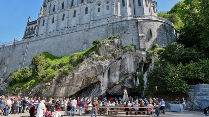 Pilgrims visiting the Sanctuary of Our Lady of Lourdes in Lourdes, France.