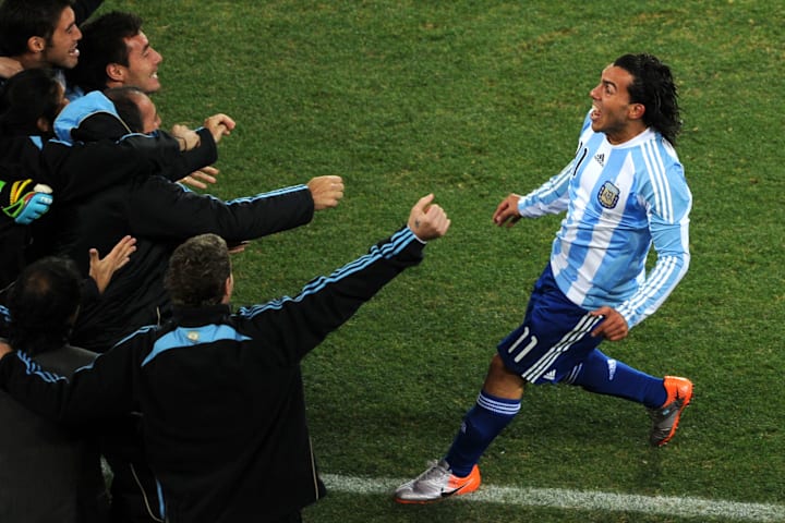Argentina's striker Carlos Tevez (R) cel