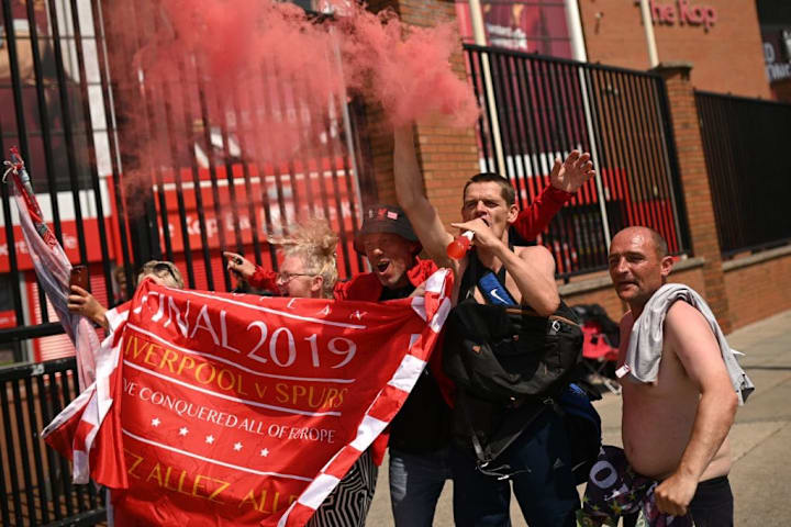 Liverpool fans celebrating outside Anfield