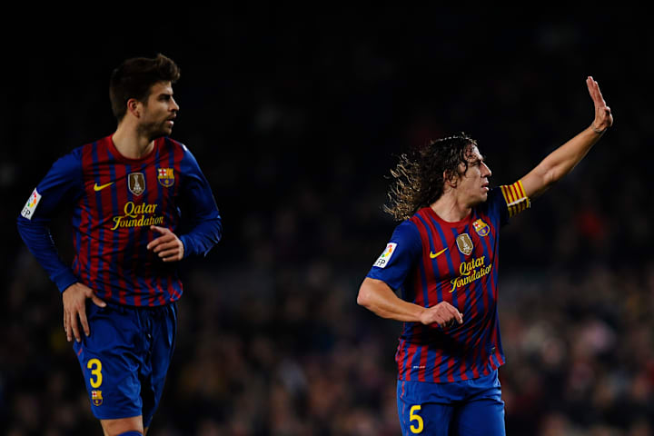 Gerard Piqué y Carles Puyol