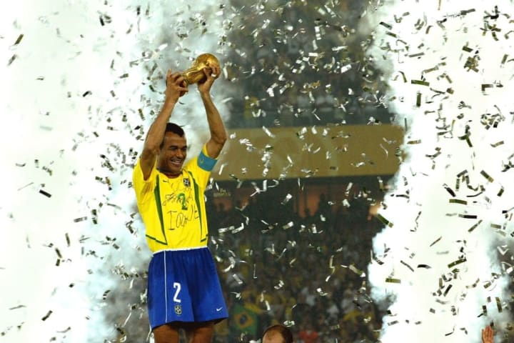 Cafu winning the World Cup as Brazil captain in 2002