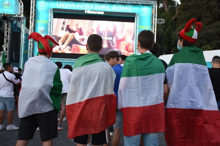 Italian fans watch Italy v Austria match from a giant screen in Rome